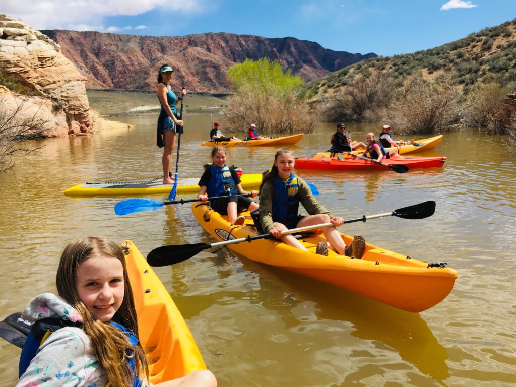 Guests enjoy a paddling moment in the slot canyon at high water.